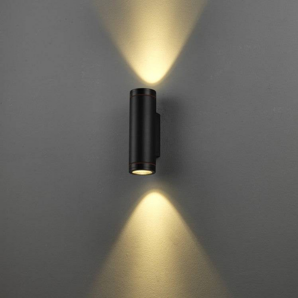 Ultra Beam Lighting Ltd black aluminium LED outdoor wall light with dual up and down beams on a grey wall