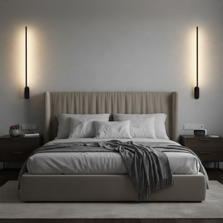 Ultra Beam Lighting Ltd 10W LED black wall lights mounted vertically in a modern bedroom, creating a soft halo effect.