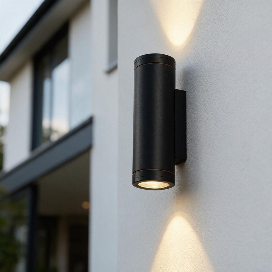 Ultra Beam Lighting Ltd black aluminium outdoor LED wall light with dual up and down beams on a modern white wall