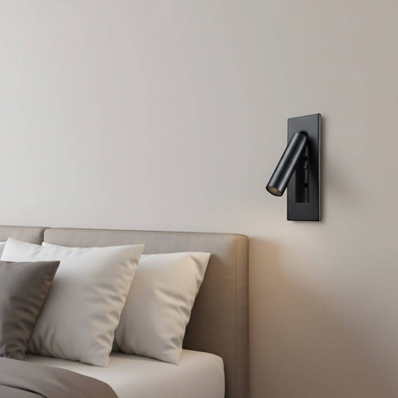 black recessed LED reading wall light mounted on the wall in a modern bedroom next to the bed