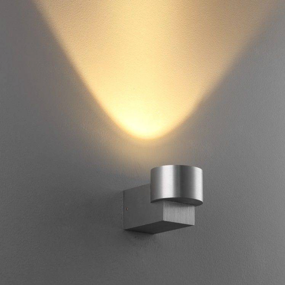 Ultra Beam Lighting Ltd 5W brushed aluminium LED wall uplight casting a warm upward light beam on a grey wall