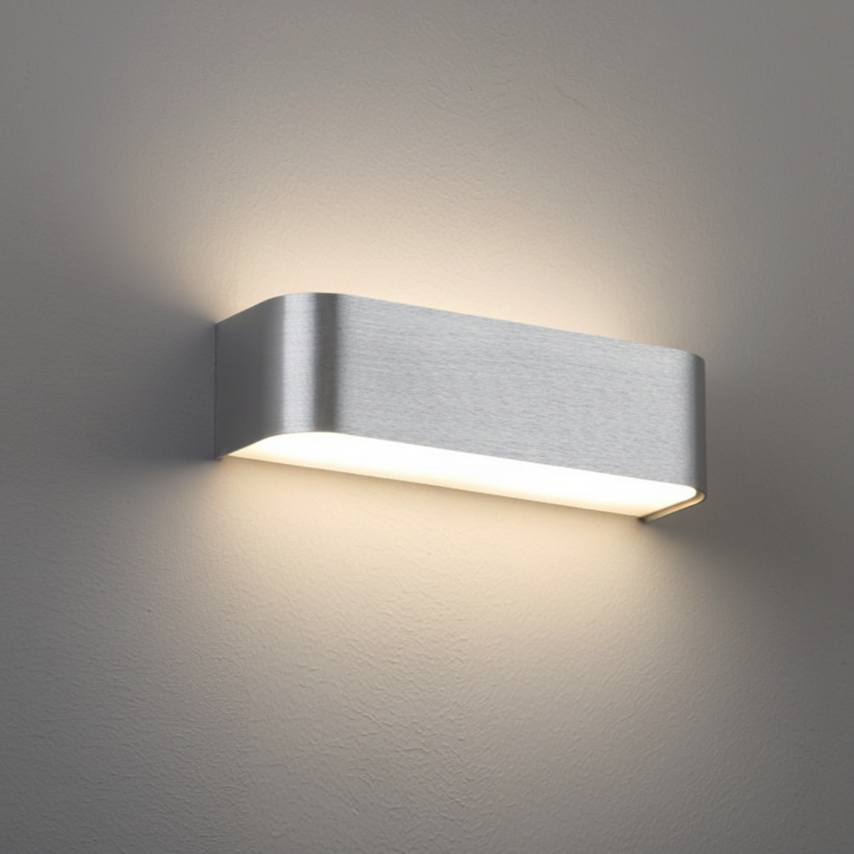 Ultra Beam Lighting Ltd brushed aluminium up and down wall light with warm LED glow on a neutral interior wall