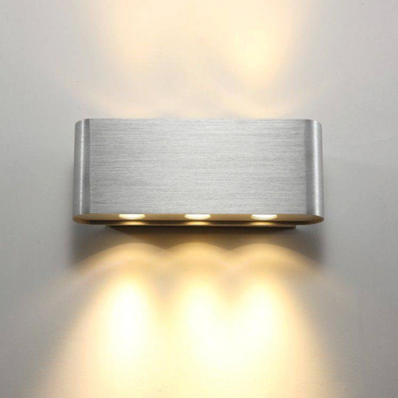 Ultra Beam Lighting Ltd brushed aluminium wall light with six LEDs casting warm up and down light beams on a wall