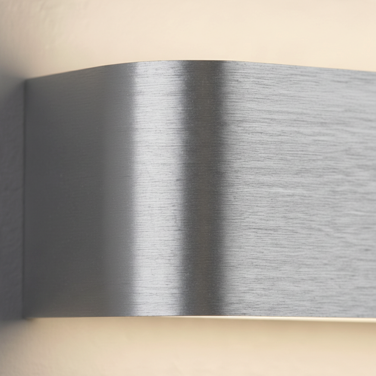 Ultra Beam Lighting Ltd brushed aluminium up and down wall light with a curved contemporary design.