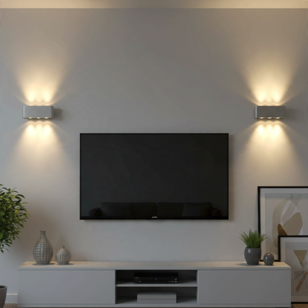 Ultra Beam Lighting Ltd brushed aluminium up and down wall lights casting warm white light on a modern living room wall