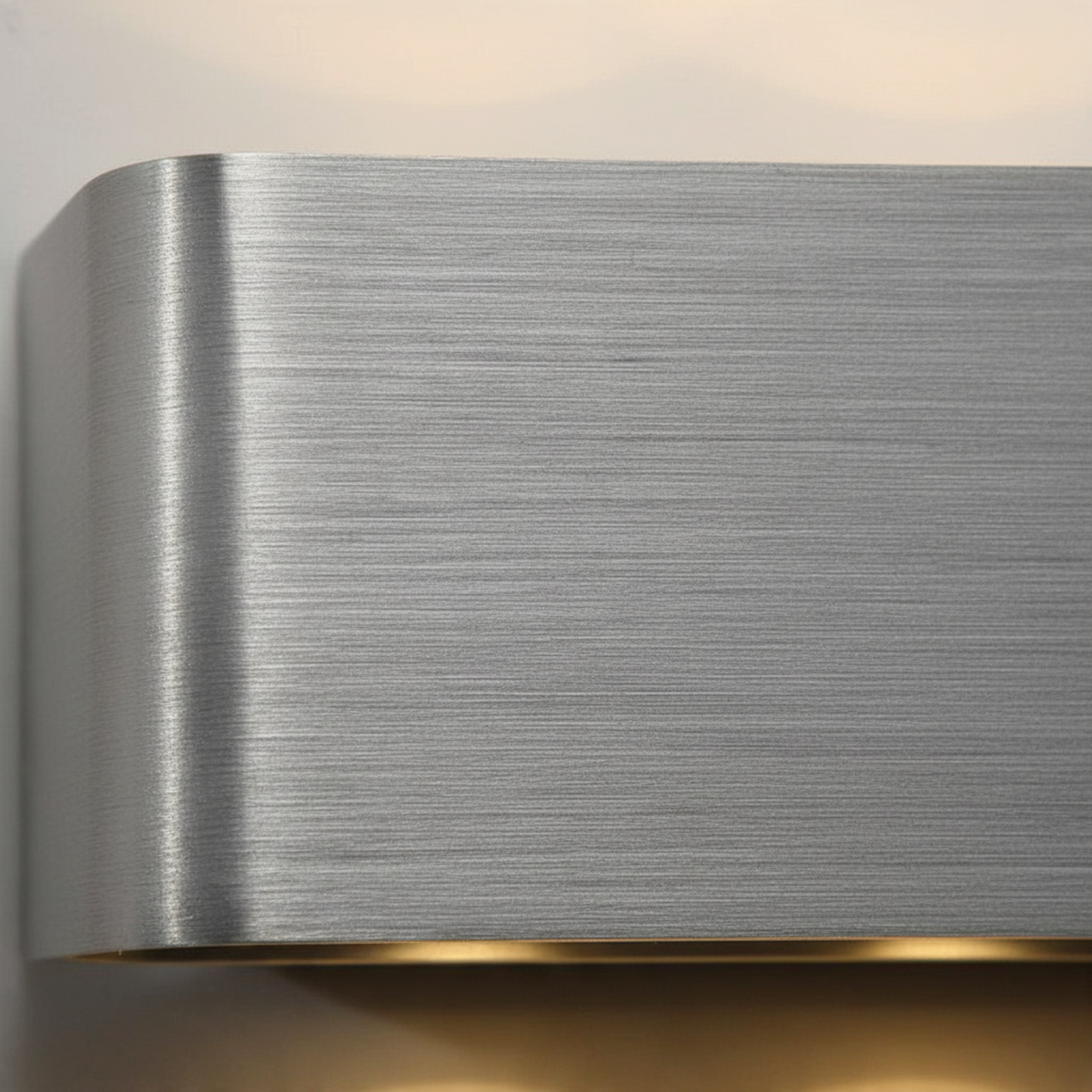 Ultra Beam Lighting Ltd brushed aluminium internal wall light with a curved design and warm LED up and down lighting.