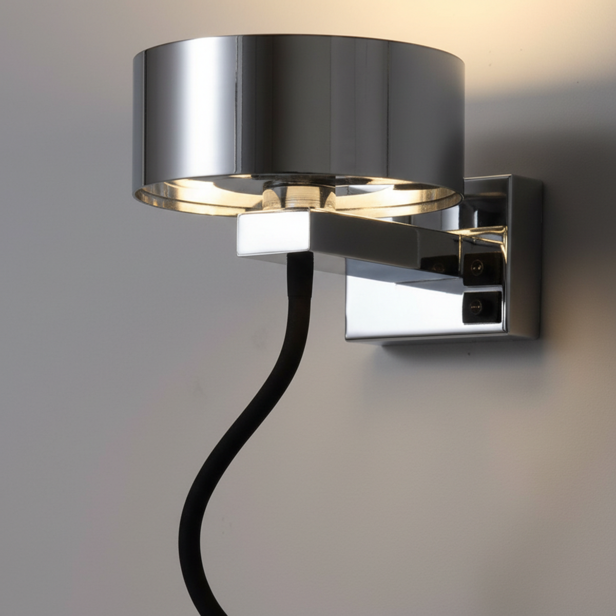 Ultra Beam Lighting Ltd polished chrome bedside wall lamp with a flexible black arm reading light and dual switches.