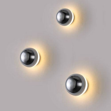 Ultra Beam Lighting Ltd 6W dome shaped chrome LED wall light with halo effect illumination on a neutral wall.