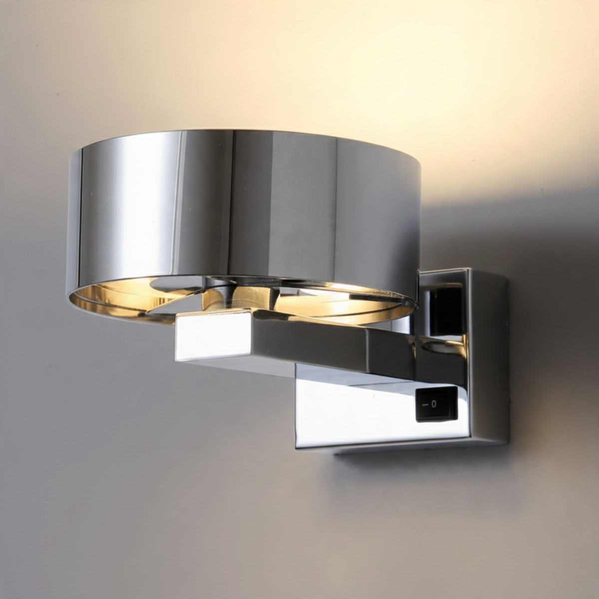 Ultra Beam Lighting Ltd 6 watt chrome LED bedside wall reading light with a modern cylindrical design and switch.