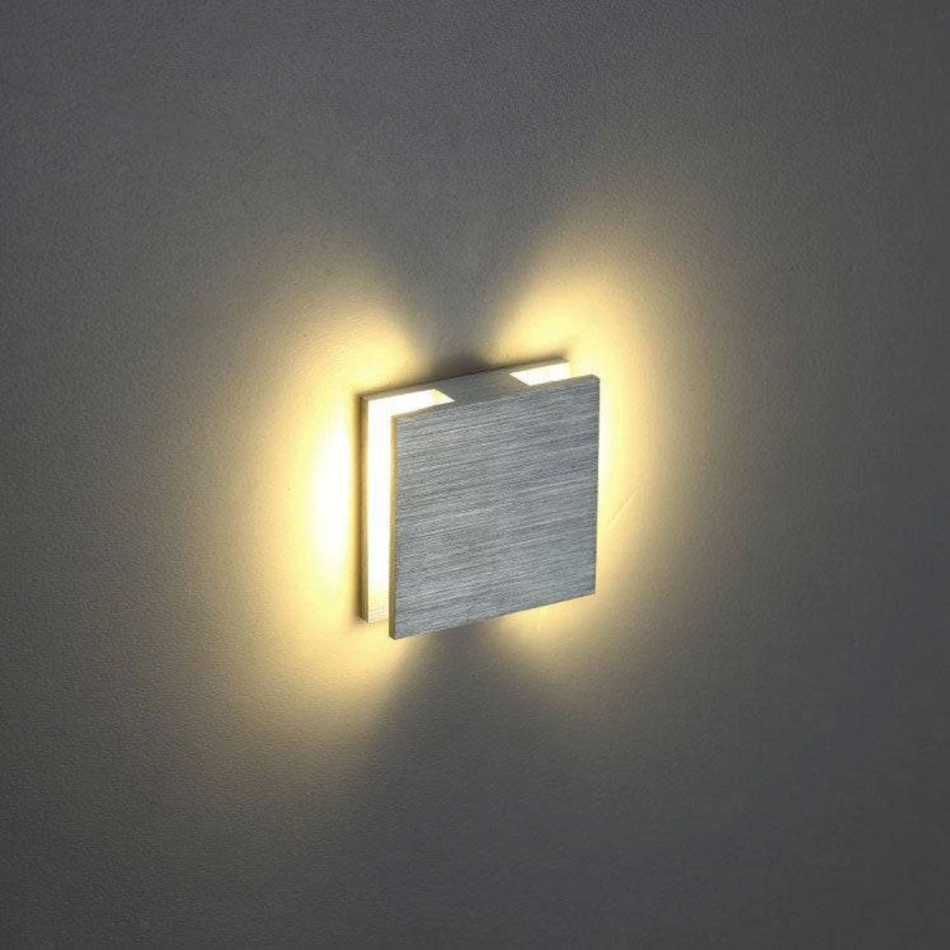 Ultra Beam Lighting Ltd Halo square 1 watt brushed aluminum recessed LED stair light with warm side-projecting glow.
