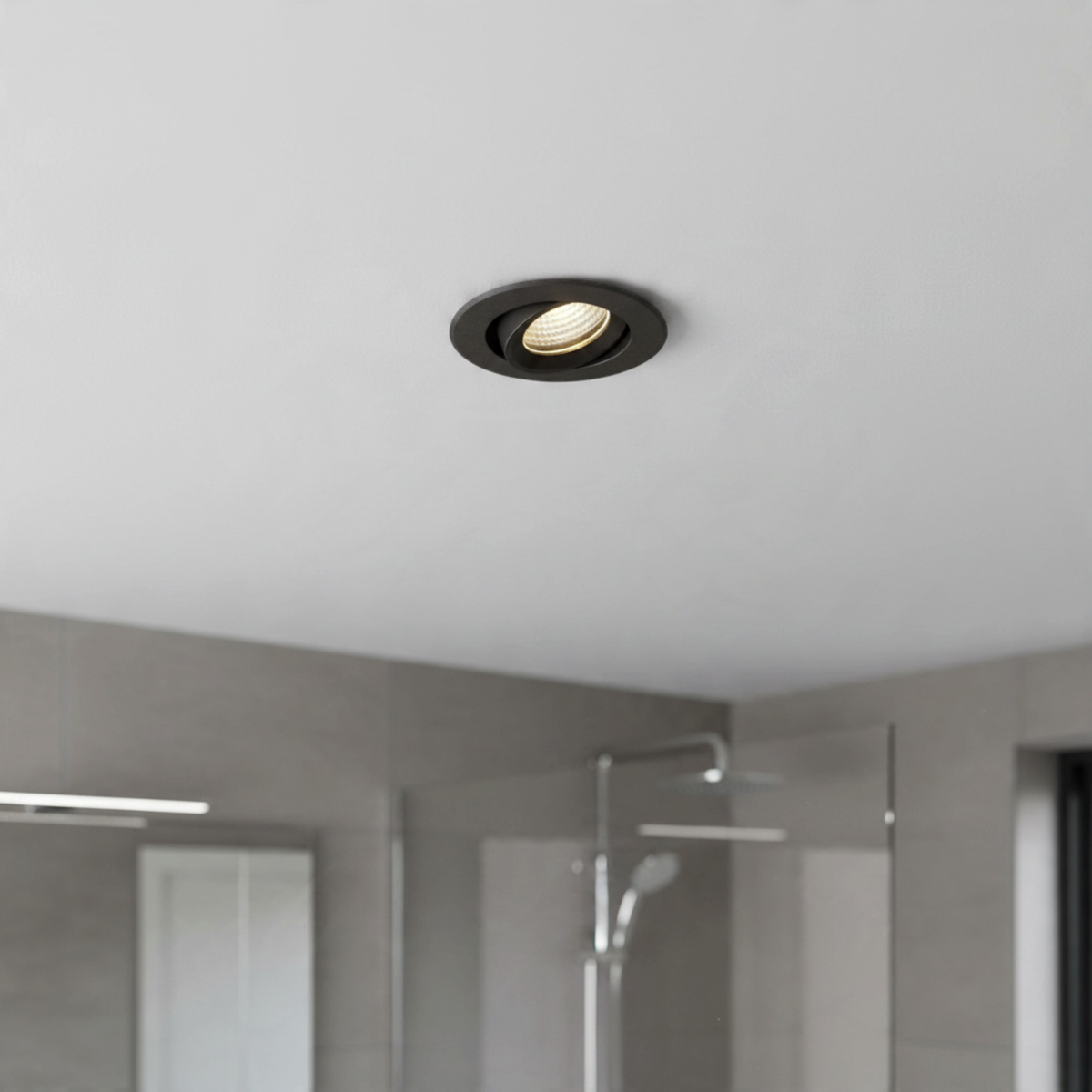 Ultra Beam Lighting Ltd Onyx 6W black recessed LED downlight with gimbal tilt installed in a bathroom ceiling