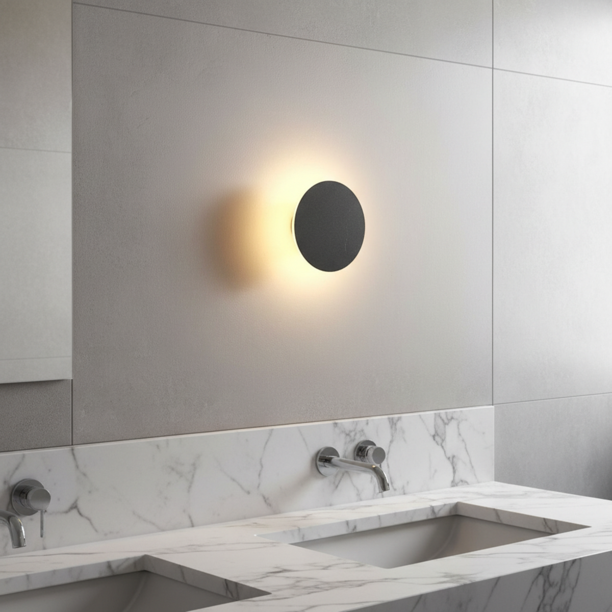 Ultra Beam Lighting Ltd 6W round black bathroom sconce with warm 3000K LED light mounted on a grey tiled wall.