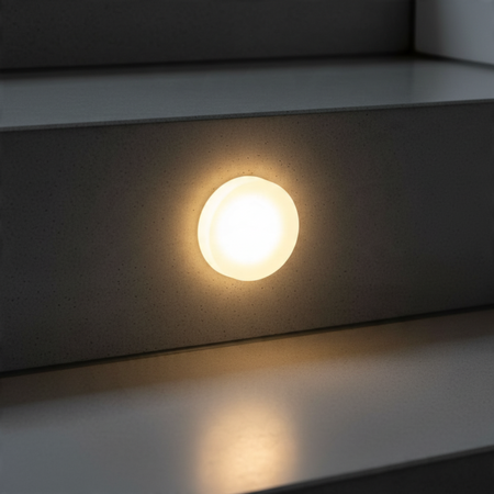 Ultra Beam Lighting Ltd round 1 watt recessed LED stair light with a soft glowing sand-blasted acrylic diffuser