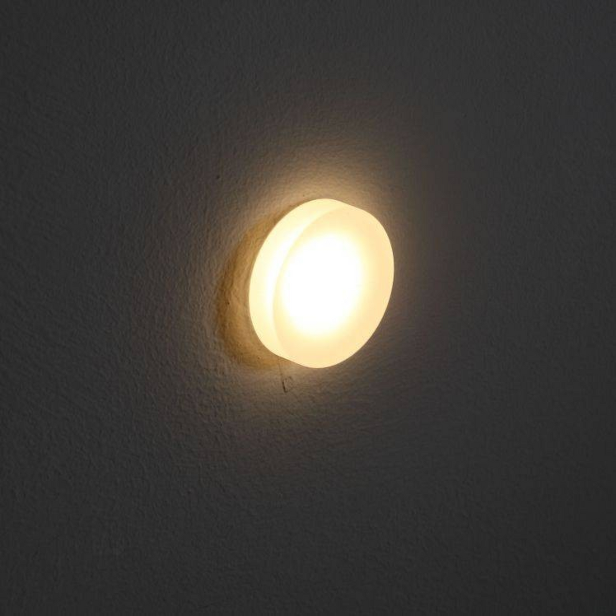 Ultra Beam Lighting Ltd round 1 watt recessed LED stair light with a soft glowing sand-blasted acrylic diffuser.