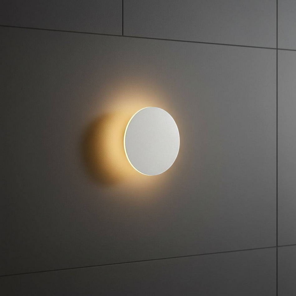 white modern bathroom wall sconce mounted on a tiled bathroom wall