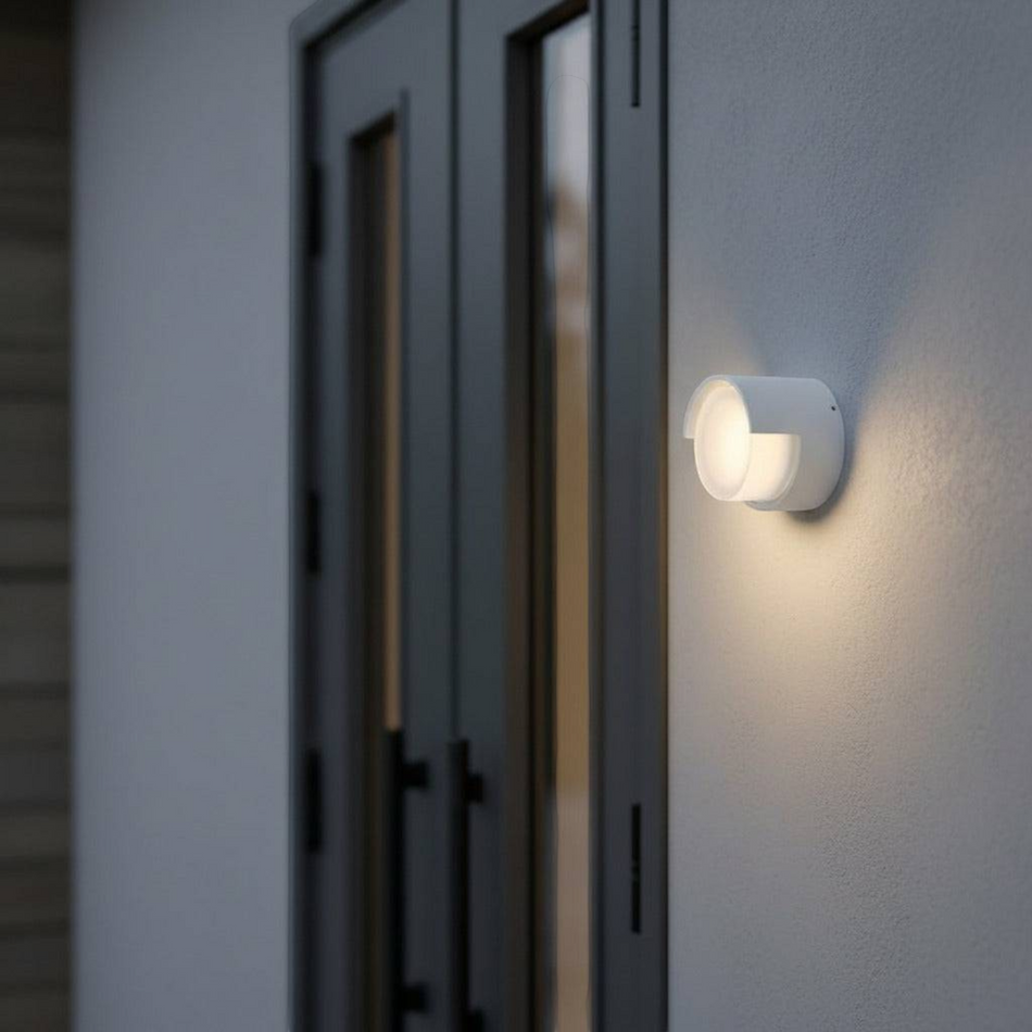 Ultra Beam Lighting Ltd round white LED garden wall light mounted next to a modern doorway