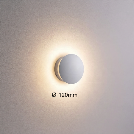 Ultra Beam Lighting Ltd 6W round white LED wall light with a soft halo glow effect on a textured wall