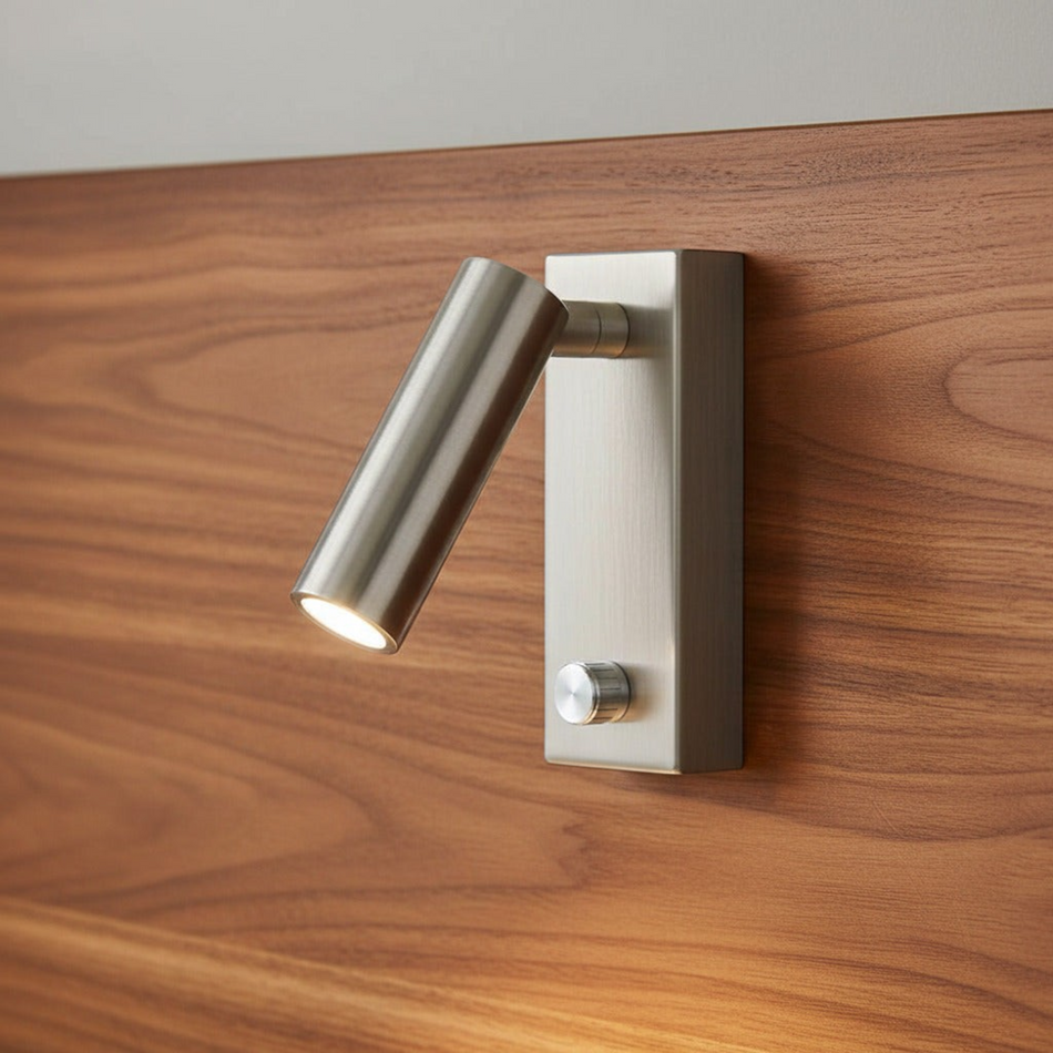 brushed nickel dimmable wall mounted reading light mounted on a wooden headboard
