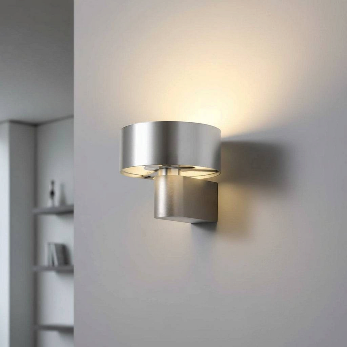 Ultra Beam Lighting Ltd modern silver lantern wall sconce with warm LED illumination on a grey interior wall