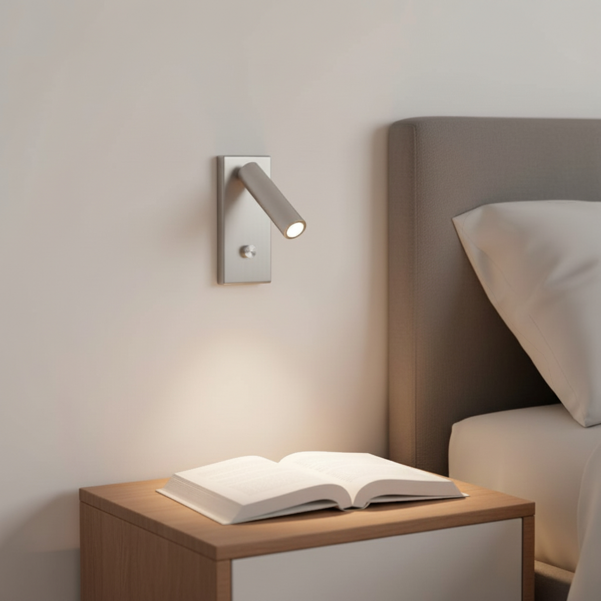 Ultra Beam Lighting Ltd silver recessed dimmable reading lamp with articulating head mounted above a bedside table.
