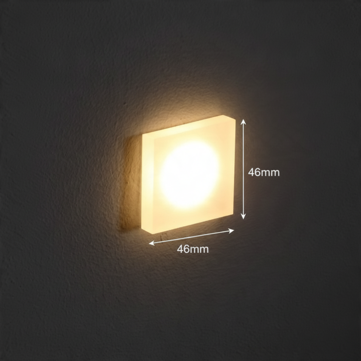 Ultra Beam Lighting Ltd square 1 watt LED recessed stair light with a sandblasted acrylic face emitting warm light.
