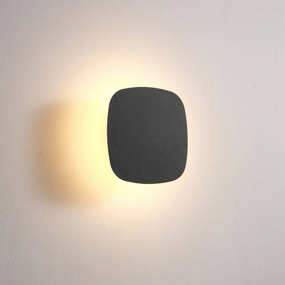Ultra Beam Lighting Ltd square black LED vanity wall light with warm halo glow for modern bathroom interiors