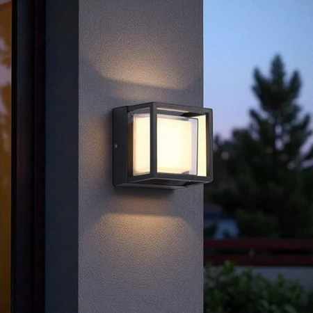 Ultra Beam Lighting Ltd 12W square black aluminium outdoor wall light with frosted lens emitting warm white light
