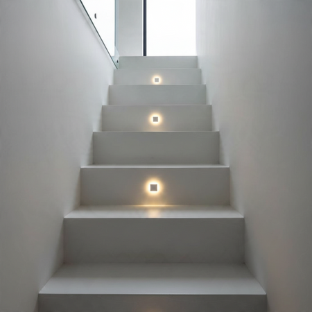 Ultra Beam Lighting Ltd square recessed LED step lights installed on a modern white staircase for ambient illumination