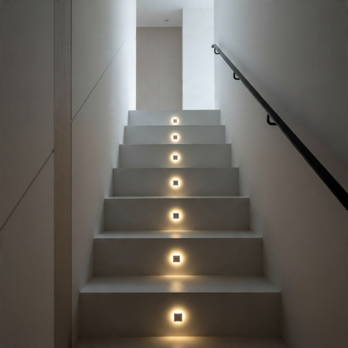 Ultra Beam Lighting Ltd square recessed LED step lights installed in a modern staircase for ambient illumination