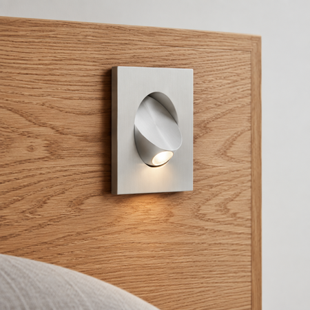 Ultra Beam Lighting Ltd square white recessed LED reading light installed in a wooden headboard with tilt switch
