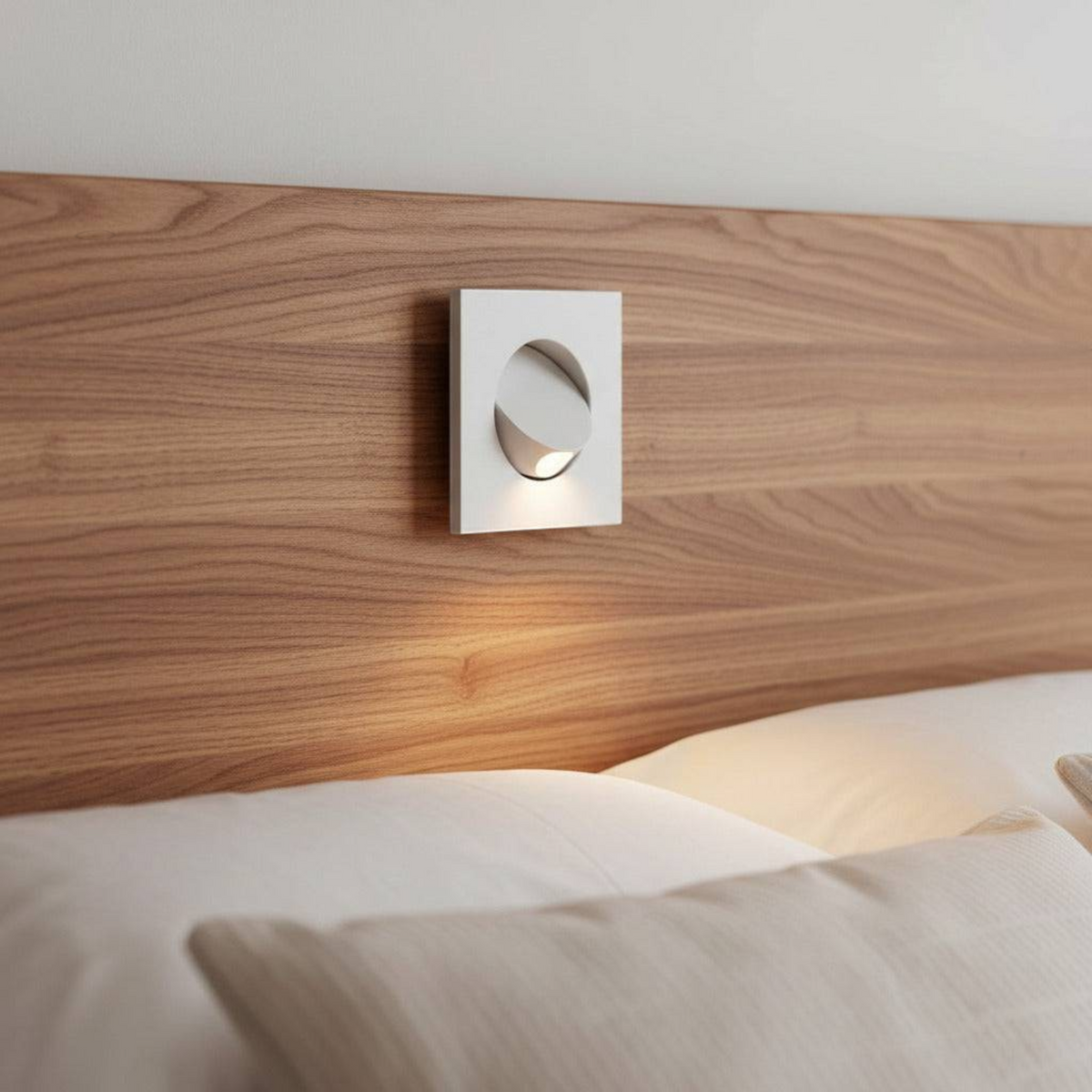 Ultra Beam Lighting Ltd square white recessed LED reading light installed in a wooden headboard