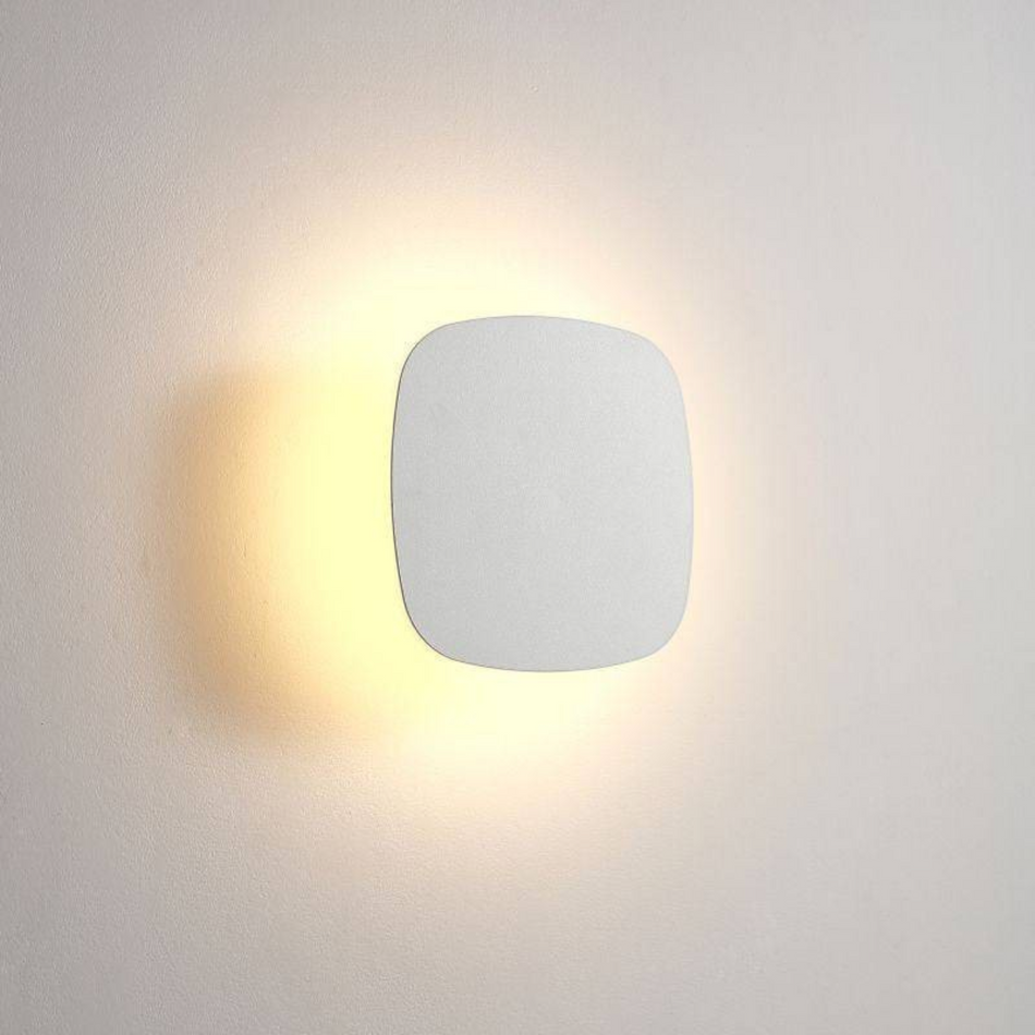 Ultra Beam Lighting Ltd square white LED bathroom wall light fixture with a warm halo glow effect.