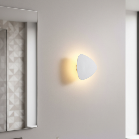 Ultra Beam Lighting Ltd triangular white LED vanity light mounted on a wall creating a warm halo effect
