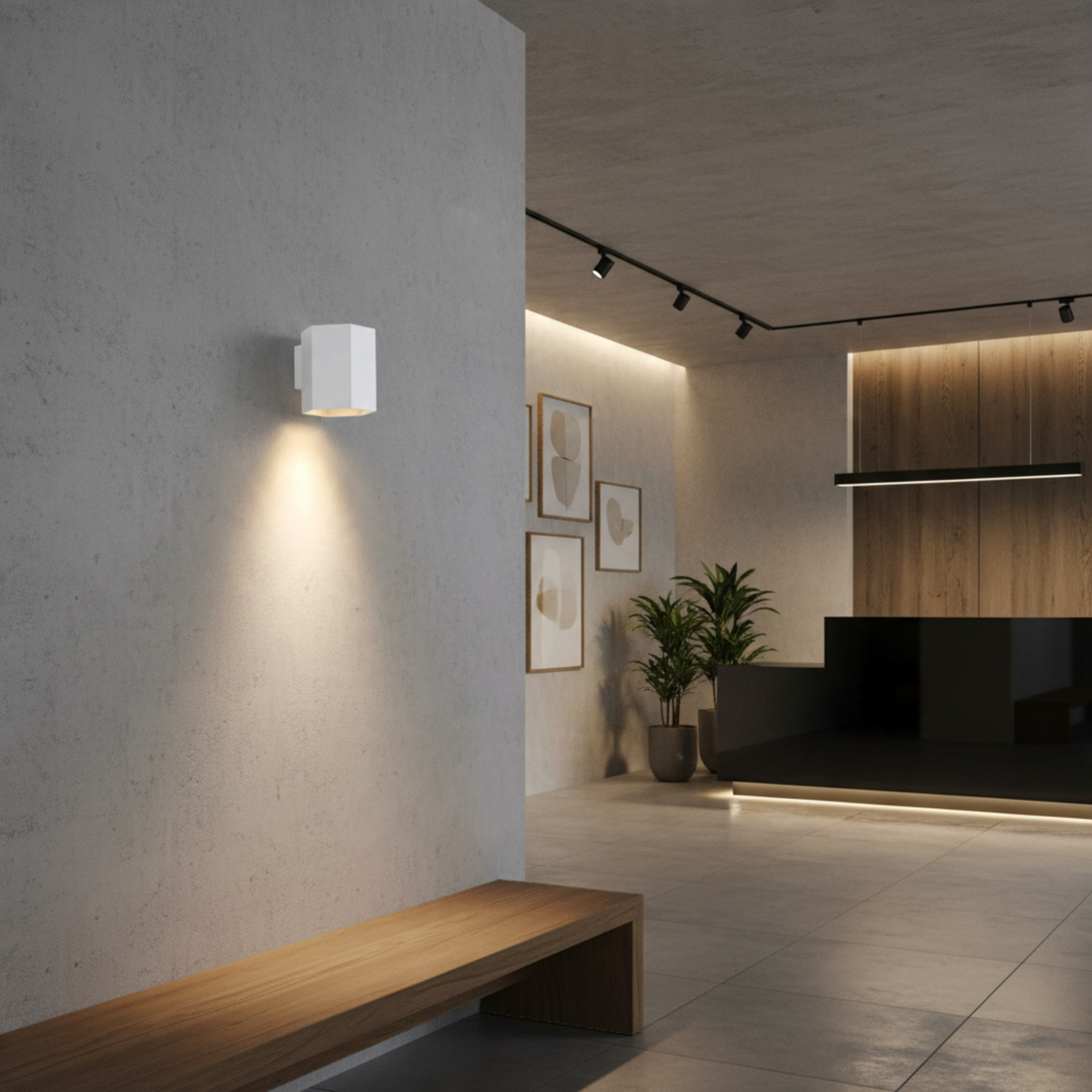 Ultra Beam Lighting Ltd white hexagonal LED wall downlight casting a warm downward beam on a modern interior wall.