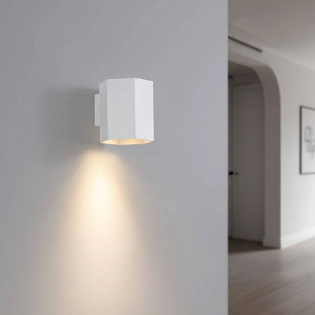 Ultra Beam Lighting Ltd white hexagonal LED wall downlight casting a warm focused beam on a contemporary interior wall