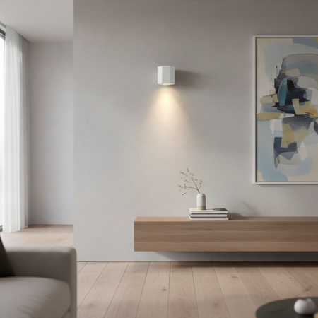 Ultra Beam Lighting Ltd white hexagonal LED wall downlight casting a warm downward beam in a modern living room.