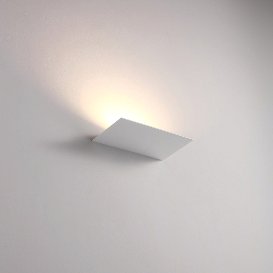 Ultra Beam Lighting Ltd 12W white LED indoor wall uplight casting a warm ambient glow on a plain interior wall