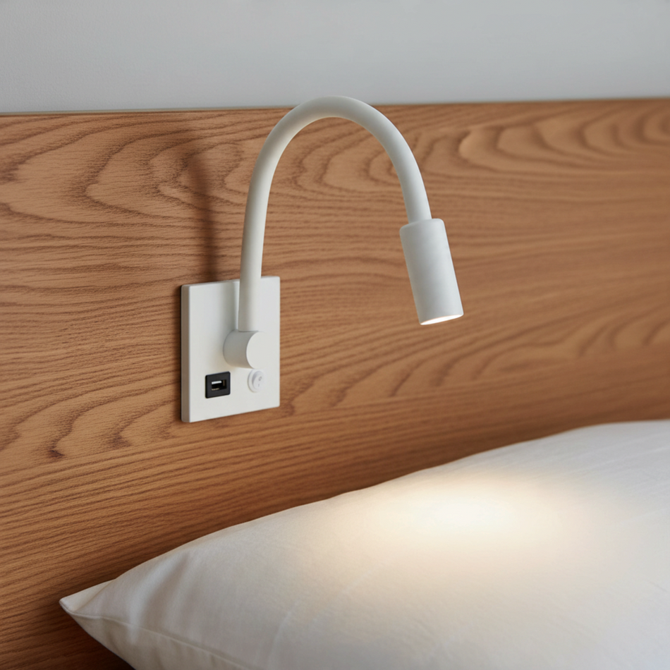 Ultra Beam Lighting Ltd white flexible LED reading lamp with integrated USB charging port mounted on a wooden headboard