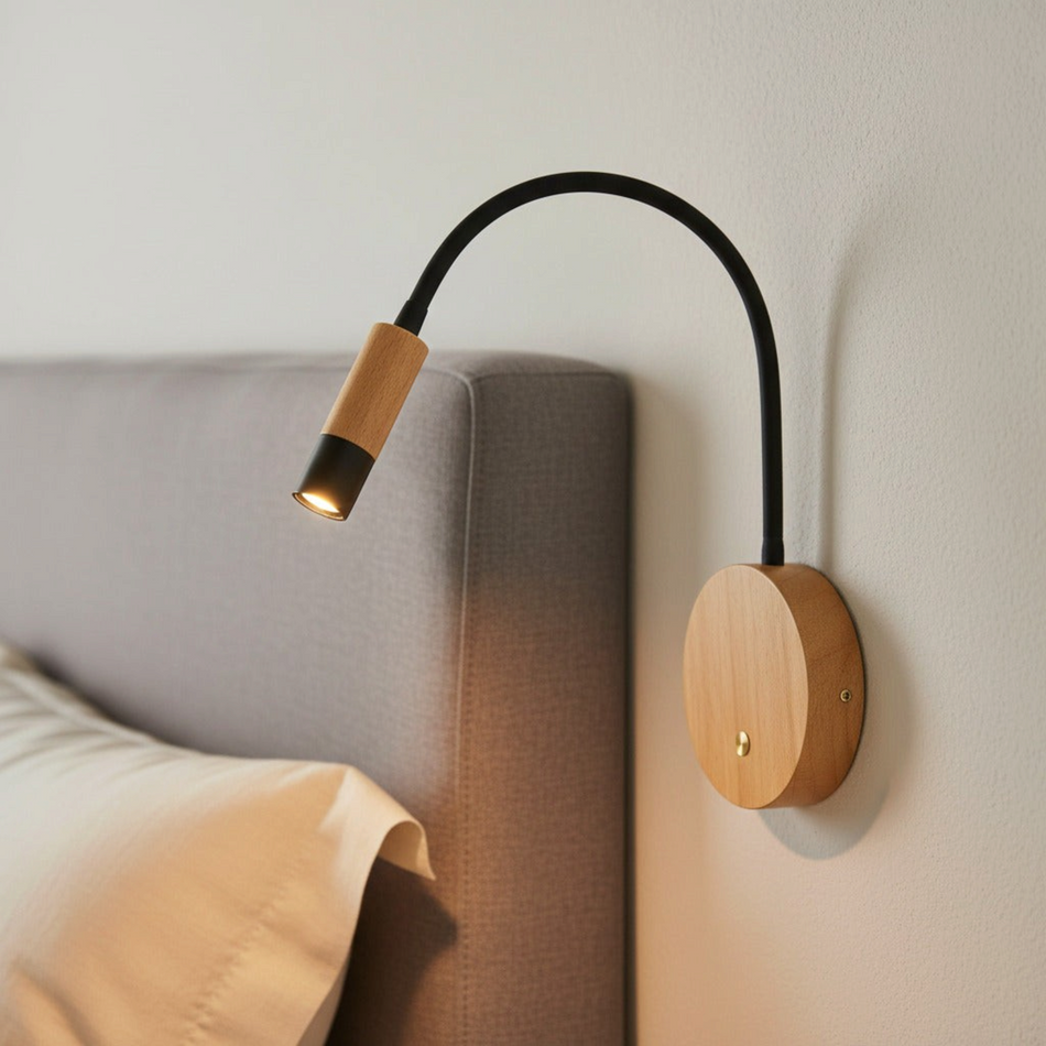 Ultra Beam Lighting Ltd 3W LED reading lamp with a flexible black arm and natural beech wood base mounted on a wall.
