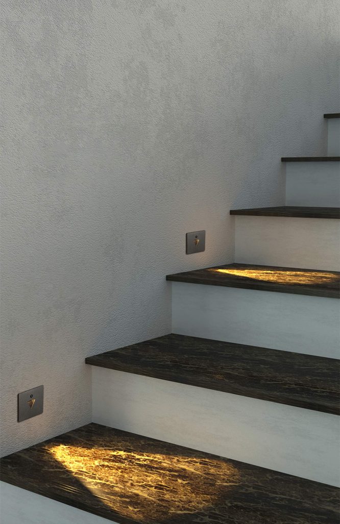 Low level led wall lighting - stairway step lights shining on stairs