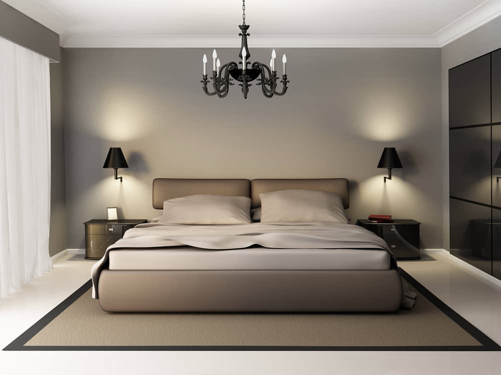 Modern bedroom with wall lights and hanging pendant light