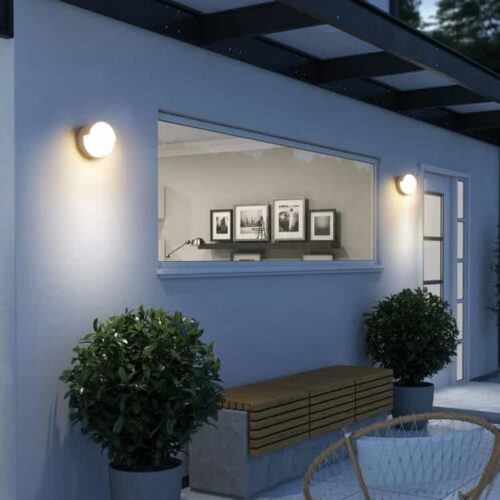 LWA383-WT round white outdoor wall light fitted on a home exterior